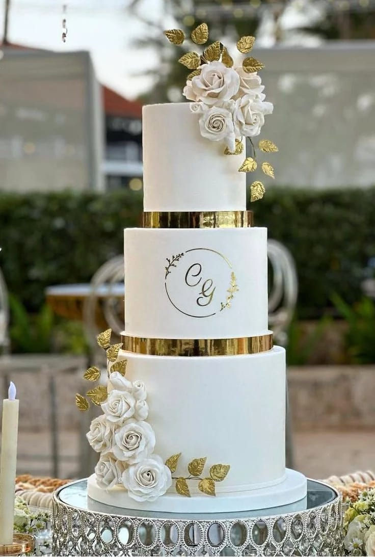 CUSTOM WHITE AND GOLD THREE TIERED FONDANT WEDDING CAKE