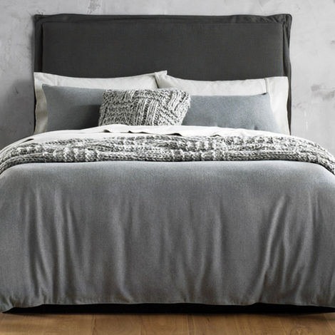 Grey flannel bedding set on modern bed with soft texture