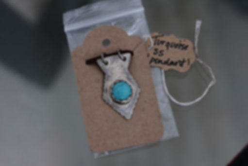 turquoise, and sterling silver twisted love heart pendant handmade jewelry from Blu Artwork Designs taken in New Jersey 