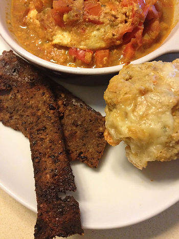 shakshuka with bacon, veggie cheese muffin