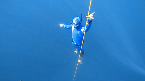 advanced freediver coming up from a dive