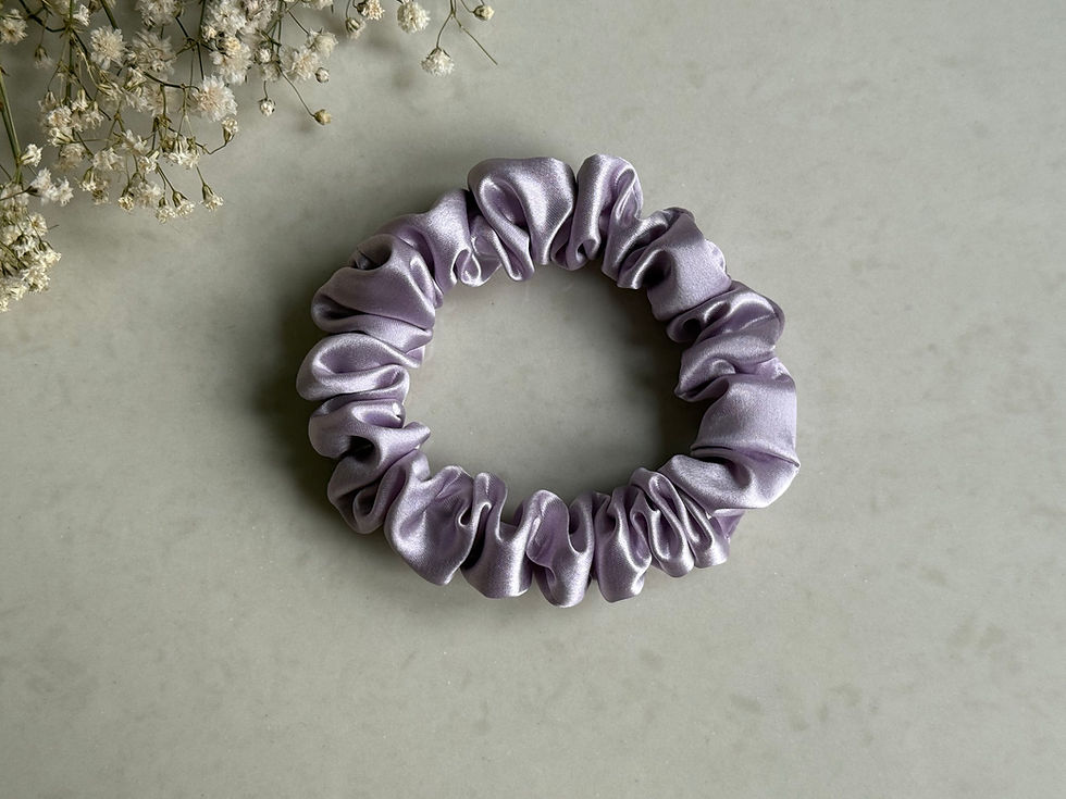 Luxurious mulberry silk lavender hair scrunchie, perfect for a gentle, snag-free hold.