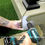 Thumbnail: Man installing the HG Corner Fascia Trim on a deck with an electric drill.