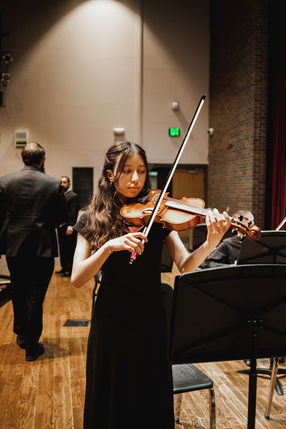 Young girl plays first violin