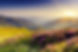 Sonnenaufgang über blühenden Bergen