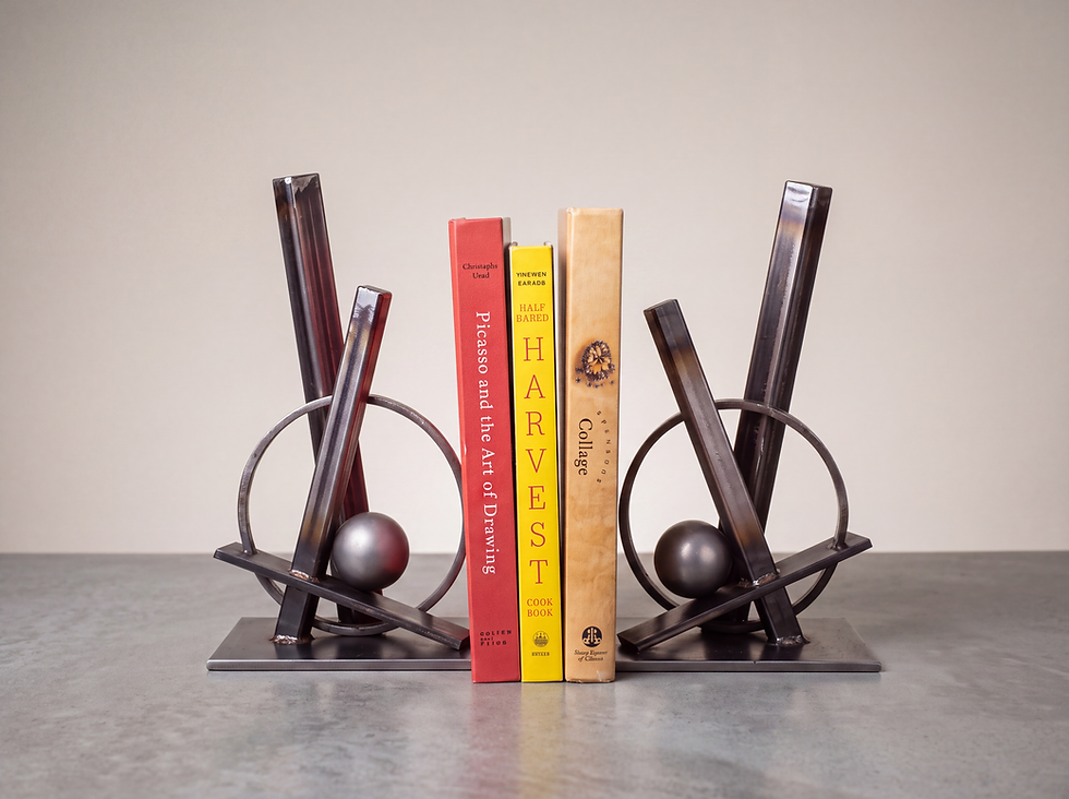 Dualis sculptural stainless steel bookends supporting a collection of books