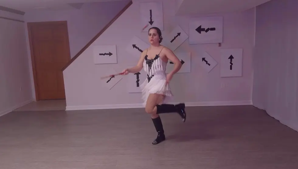 Pittsburgh cirucs artist juggles drumsticks in the basement of a local choreography studio.
