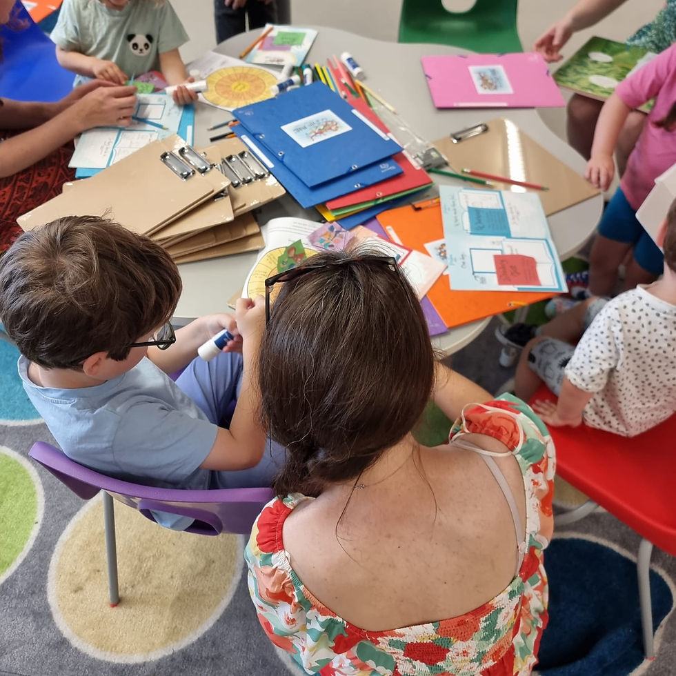 A parent and child creating their story book at The Storymakers