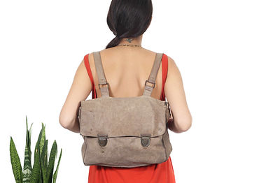 Woman wearing backpack from back