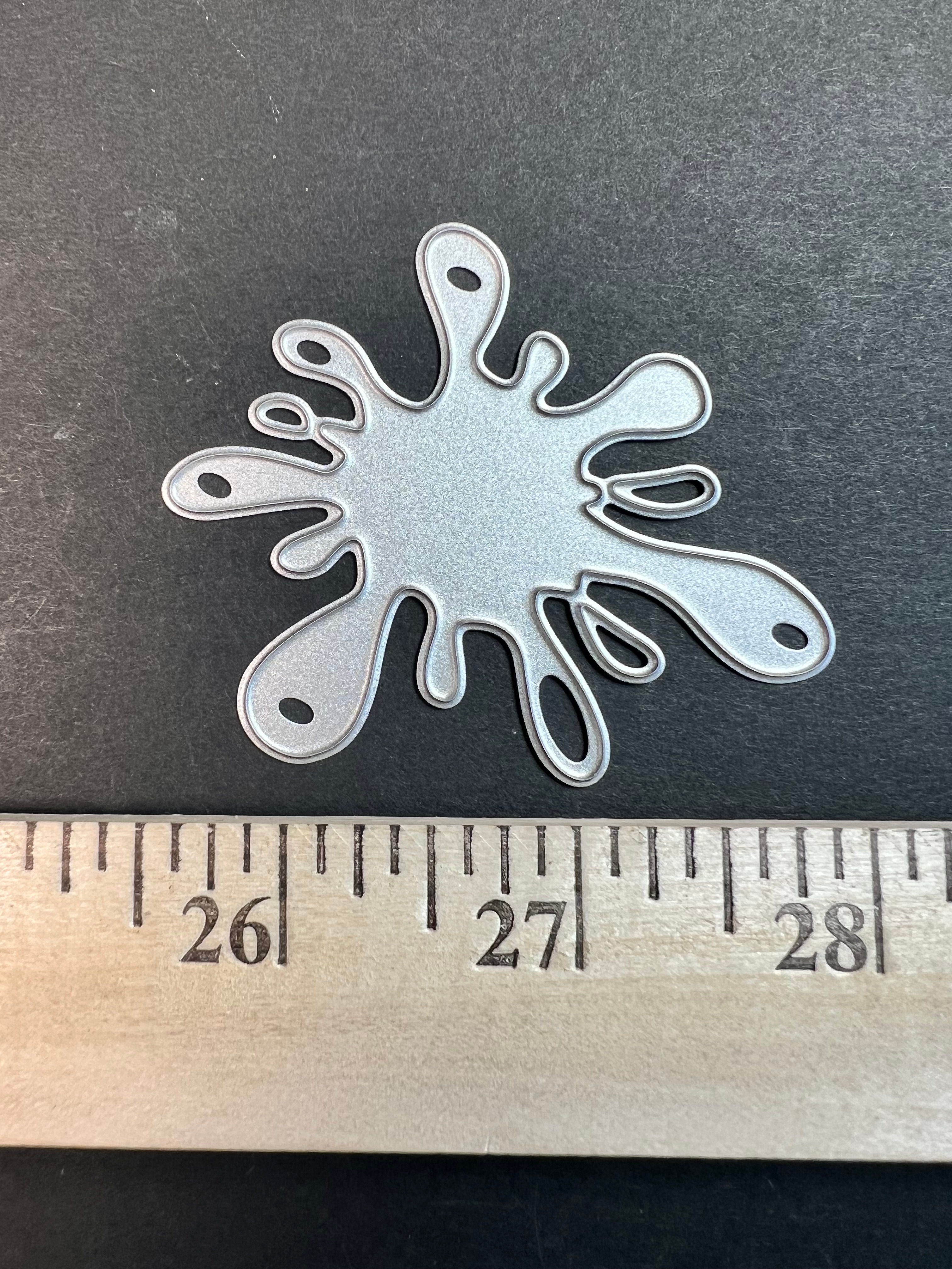Splatter thin metal  die cut thin