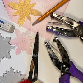 Hand cutting Shrinkets shrink plastic beads