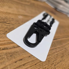 Black and white rope with a black hook on a white card