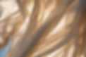 Flowing beige linen in the wind with sunlight shining through the material - signifying peace