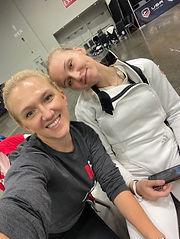 Coach Oksana and Liana smile for a photo between pools and DEs at Summer Nationals in Ohio.