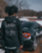 Man Wearing Hachi-Roku Schematics Hoodie with Subaru BRZ