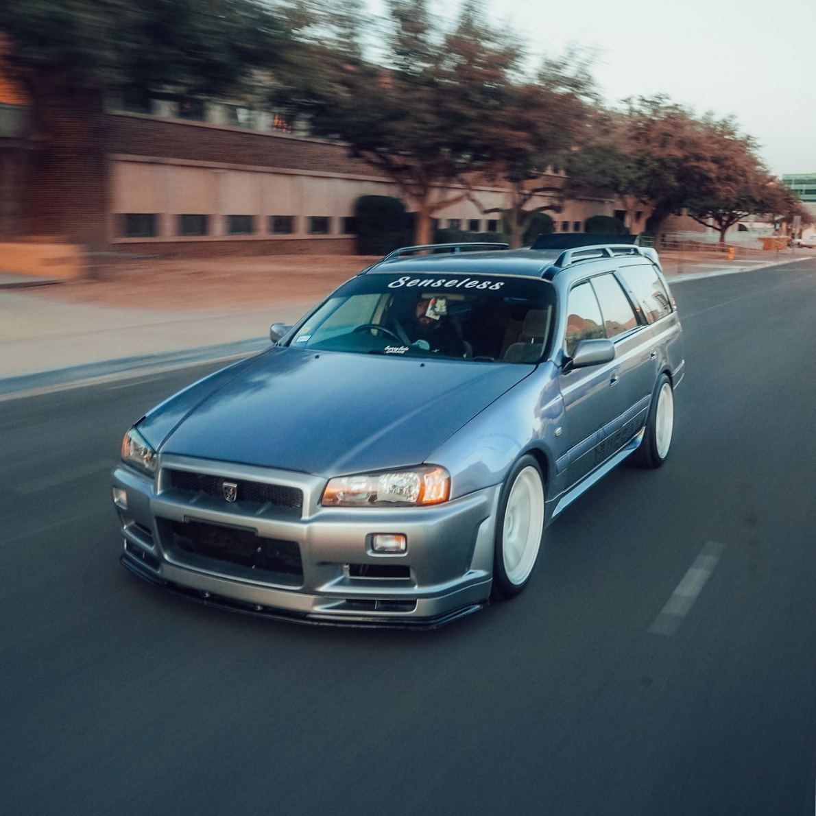 Black and White Senseless JDM Sun Strip Windshield Banner on Nissan Stagea R34