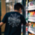 Man Wearing Senseless Spider Web T-Shirt at Convenience Store