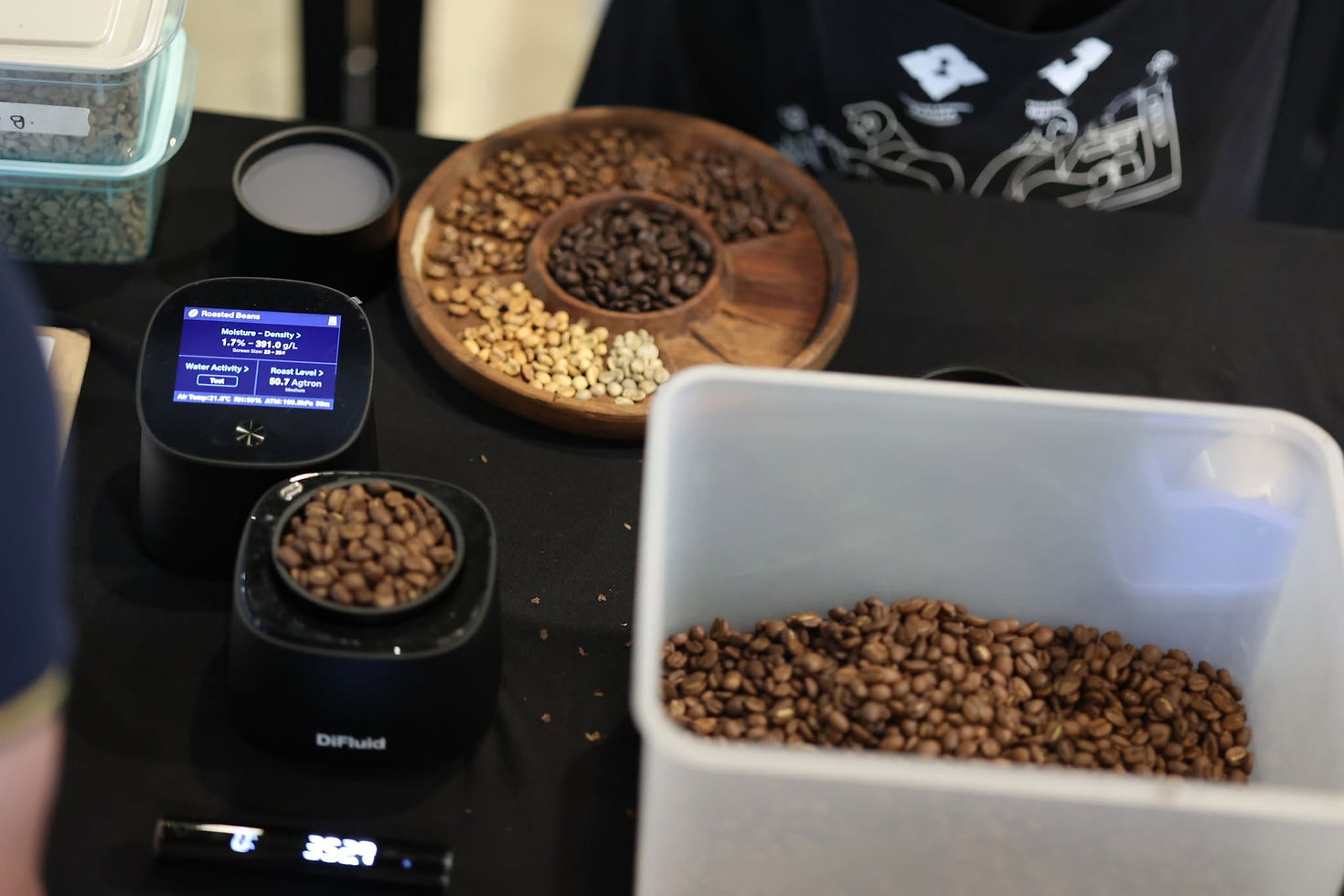 Coffee samples at different roast stages alongside a roast analysis meter and scale in the SCA Roasting Professional class.