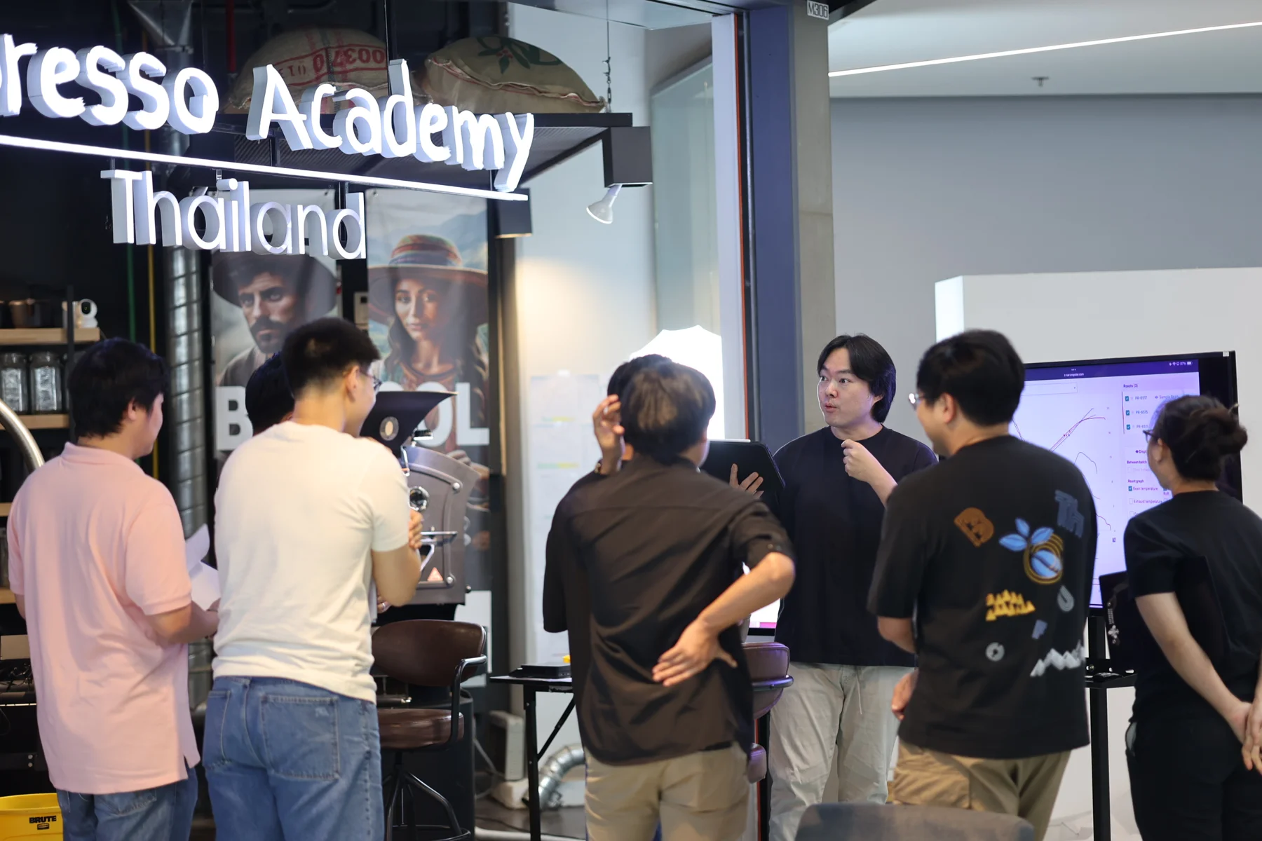 Natt explaining a roast profile to a group of students at Espresso Academic.
