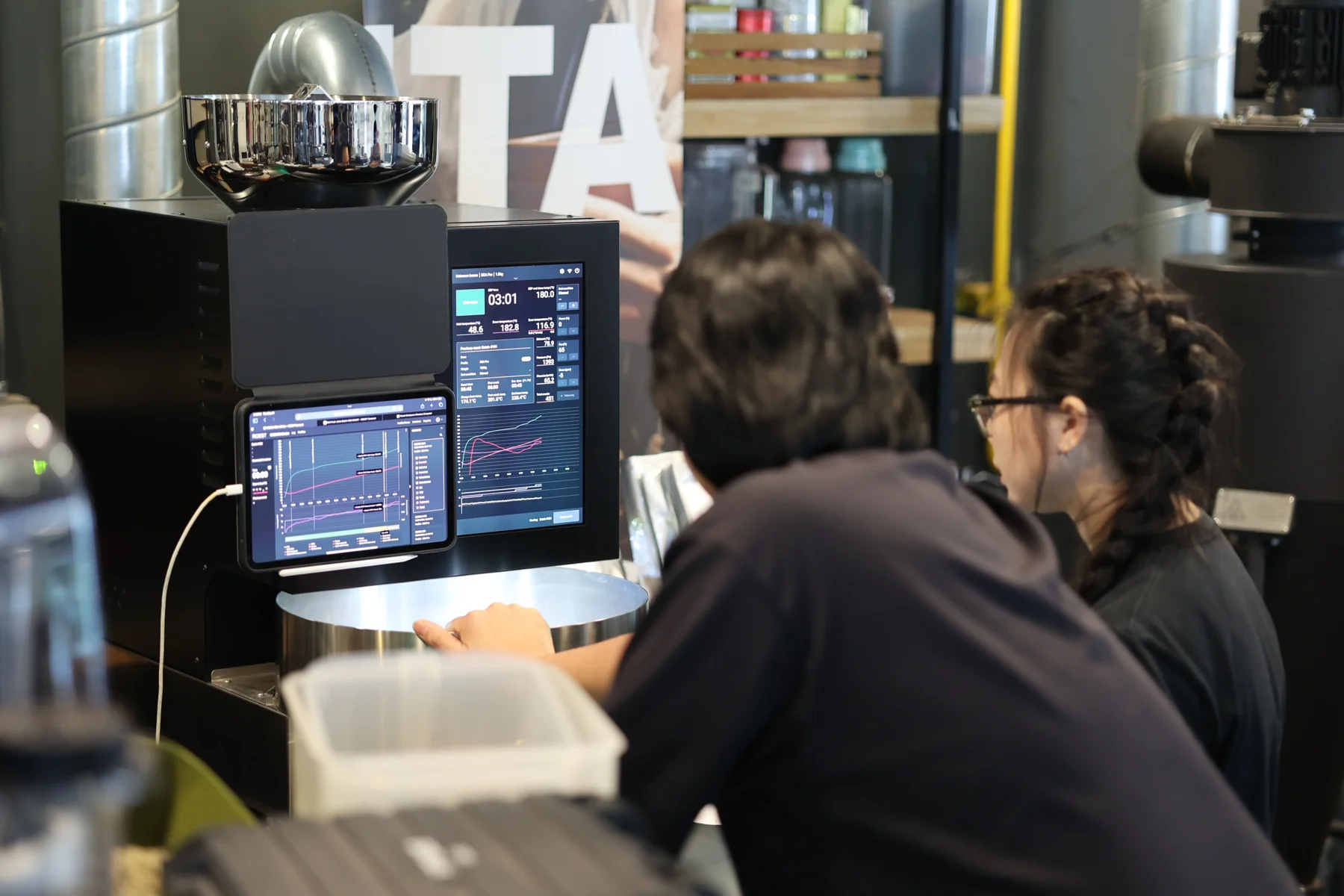 Students studying a roast profile at the ROEST roaster