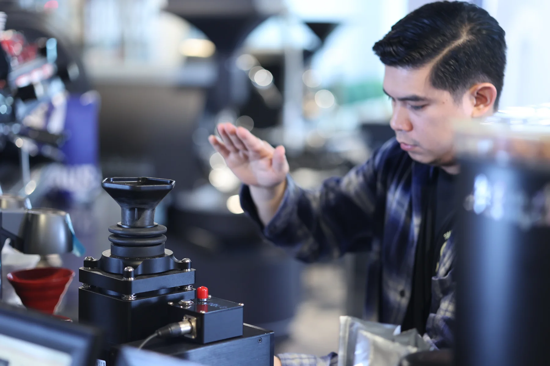 Student preparing espresso at the coffee machine