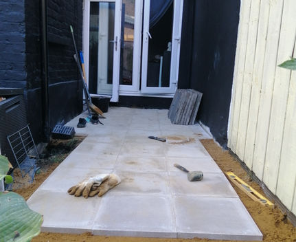 Exterior terrace construction with extensive structural and surface works, creating a durable outdoor garden living space