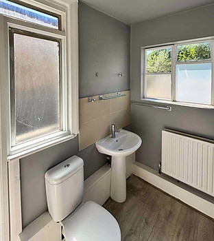 Refreshed grey HMO bathroom in willesden NW10