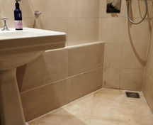 Bathroom renovation with concealed pipe tiles covering after plumbing works
