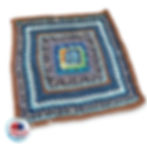 Bernat Blanket Scrap Yarn Laying Flat with Granny Square Crochet Stitches