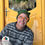 Thumbnail: Man wearing crochet hat in front of yellow door in nova scotia.