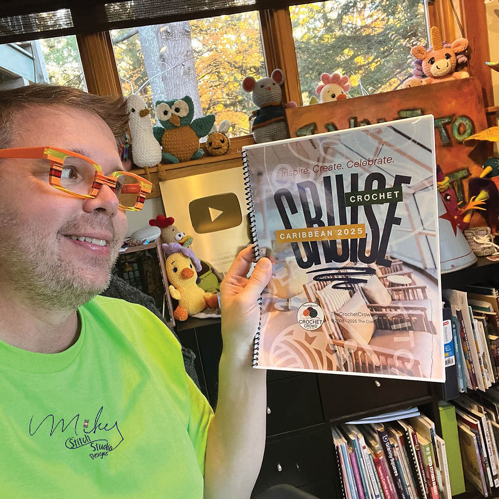 Michael Sellick, Author, holding his latest crochet workbook.