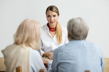 female-financial-advisor-talking-consulting-senior-aged-couple-meeting.jpg