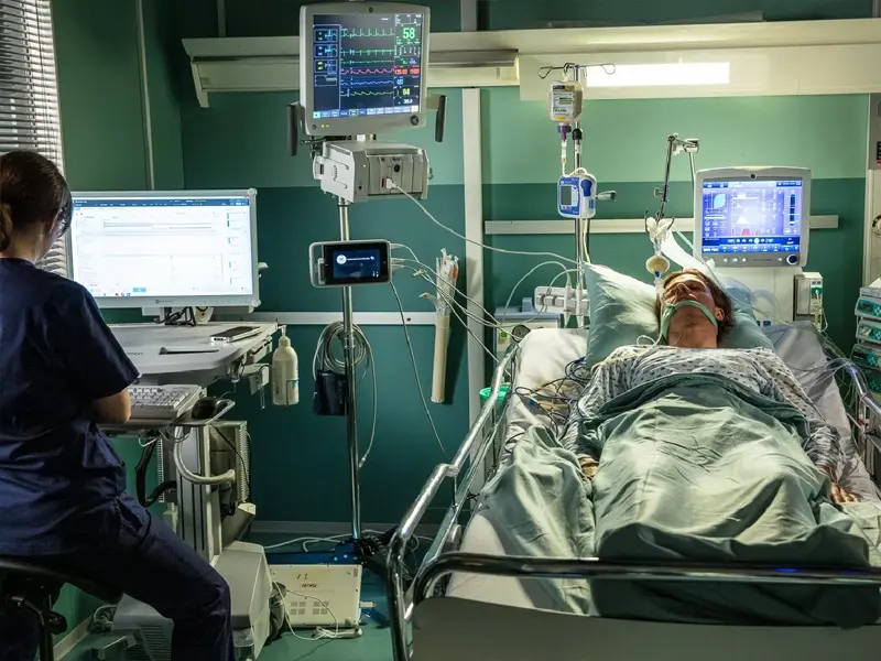 man in hospital bed