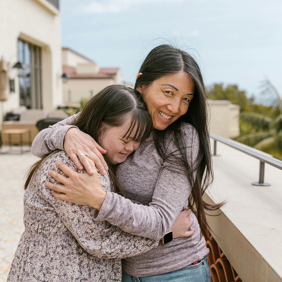 Mother and daughter hugging