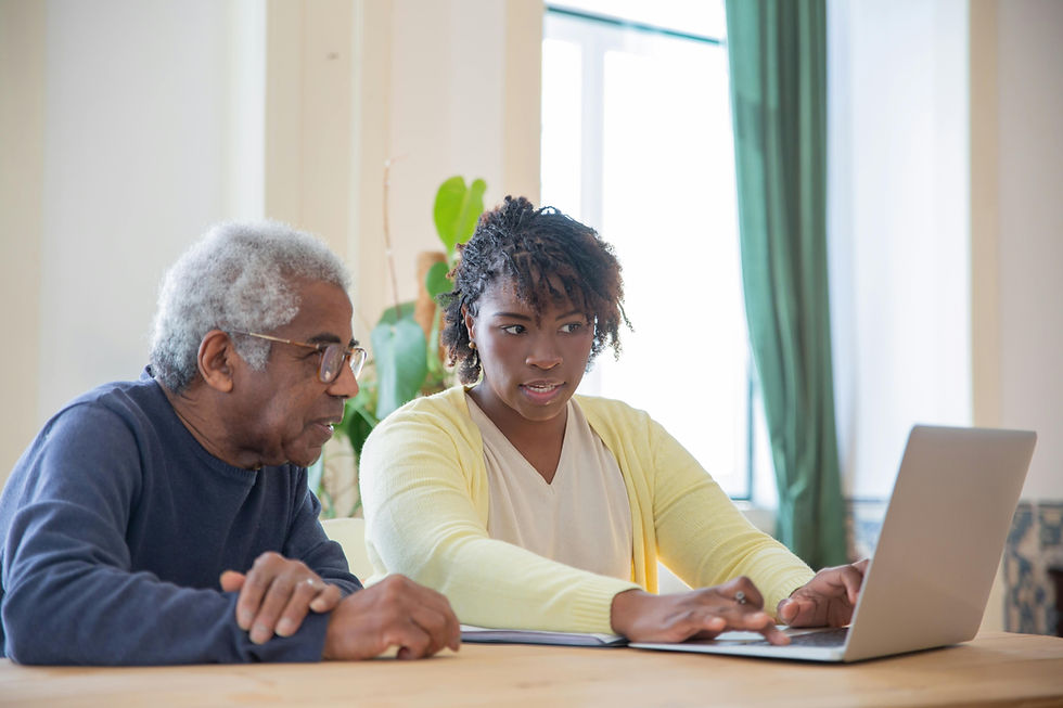woman helping elderly man understand information