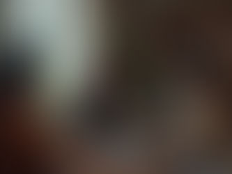 Young student sketching ideas in a notebook, thinking creatively about design or architecture.