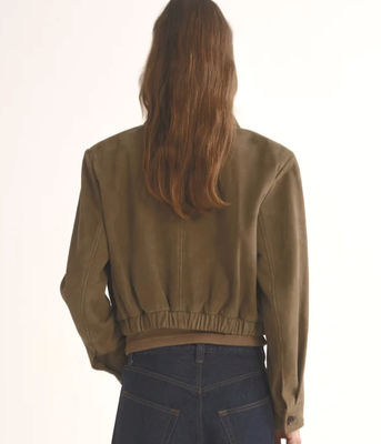 100% Suede, rendered in a soft, earthy green hue, the cropped shape and clean collar detail create a polished yet relaxed feel.