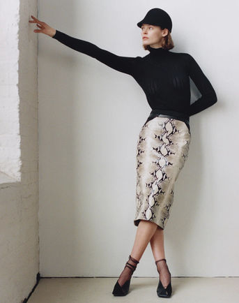 Made in New York from a striking faux python leather sourced in Italy.