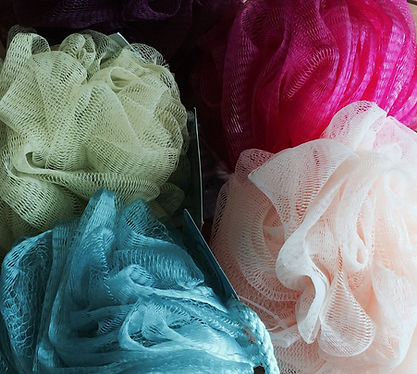 Bath poofs to be used to create a contemporary vessel by Sausalito basket artist, Emily Dvorin.