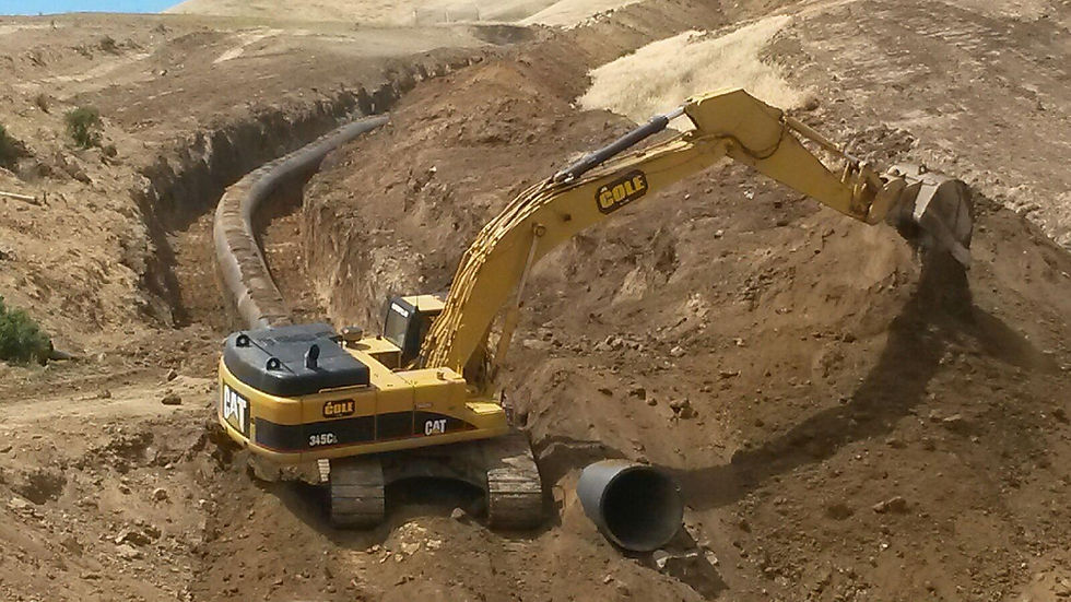 CK Earthworks equipment performing utility trenching and site preparation.