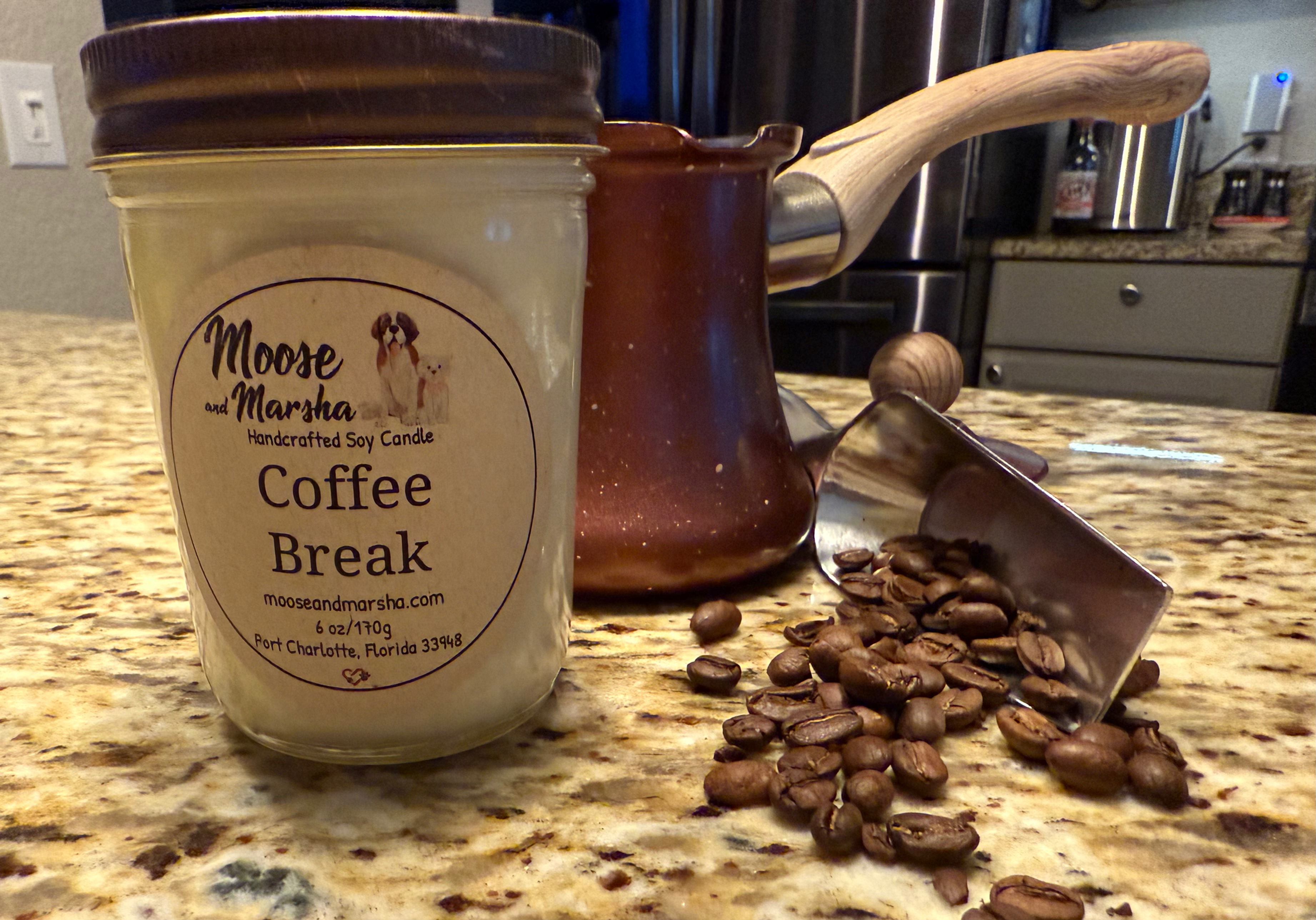 Coffee Break coffee scented soy candle on table with coffee beans