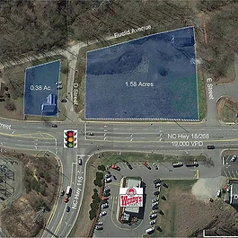 1.58-acre corner lot at traffic signal with highest traffic count in North Wilkesboro. Great visibility. Prime location for fast food, gas, retail, etc. Access to existing traffic signal. 300’ road frontage on Hwy 18/268/421-B. 195’ Road frontage. Traffic count is 19,500 vehicles per day. All utilities present. Adjoining tract available.