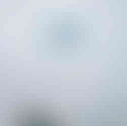 Paraglider soaring above the Miraflores cliffs along the Lima Peru coastline