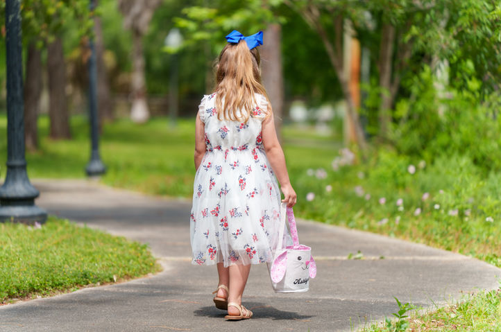Professional portrait of a girl walking a curved path in an Apalachicola FL park