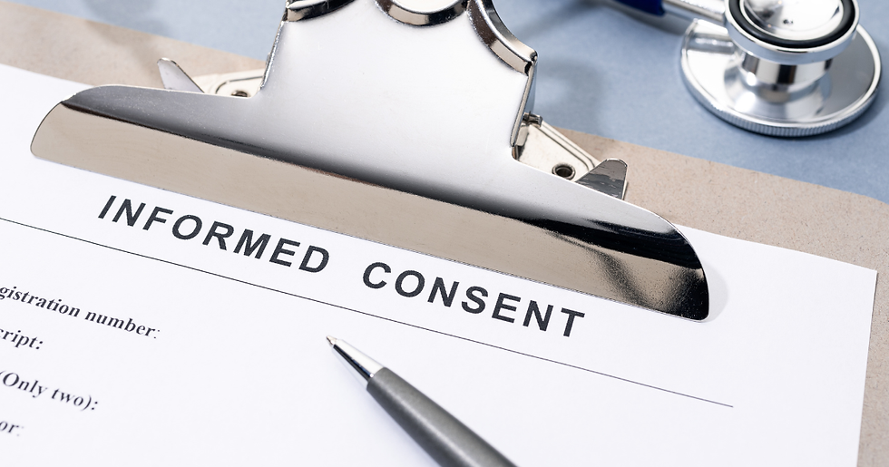 A clipboard holds a paper labeled "Informed Consent." A pen rests nearby with a stethoscope in the background on a blue surface.