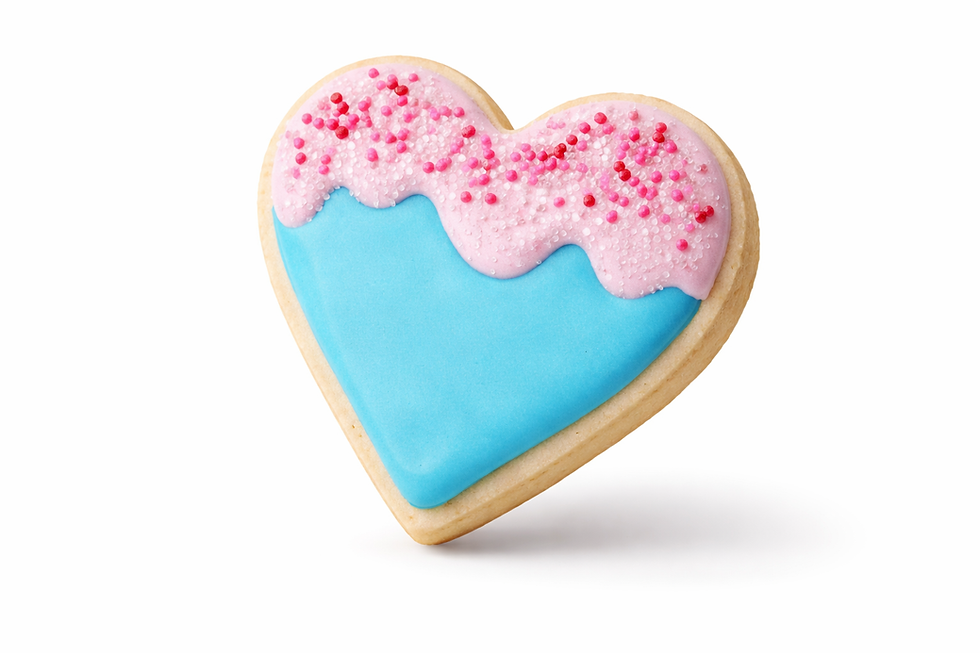 Heart-shaped cookie with blue and pink icing, topped with sprinkles.