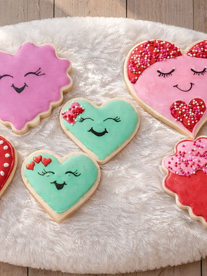 Six colorful smiling heart cookies, one says 'I Love You' text.