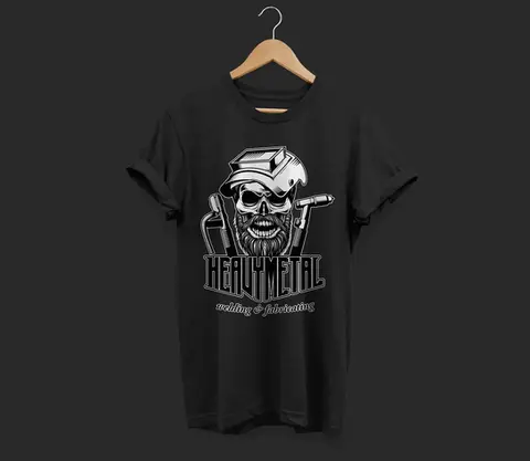 Black t-shirt with a bold logo for Heavy Metal Welding & Fabricating, featuring a skull wearing a welding mask and holding tools, with strong, angular typography reflecting the rugged nature of the trade.