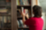 taking a book off the shelf