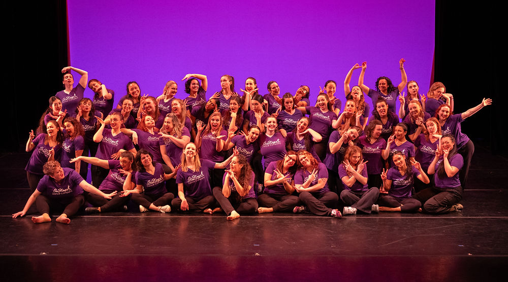 Group photo of 50 dancers wearing purple OnStage t-shirts